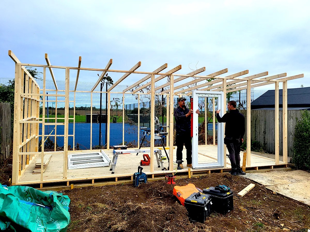 Garden art studio building in progress at bottom of garden