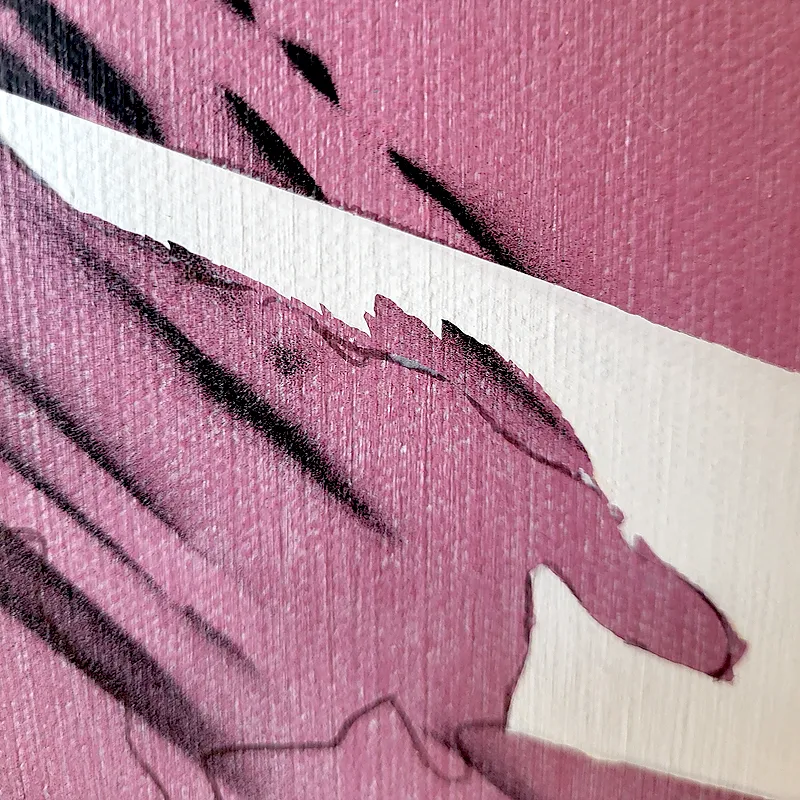 A closer look at the acrylic peeling away after I removed the masking tape. Acrylic paint peeling from the canvas after masking tape was removed
